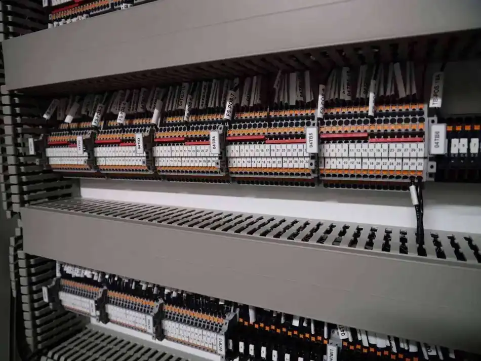 Labeled terminal blocks and control wiring inside an electrical cabinet