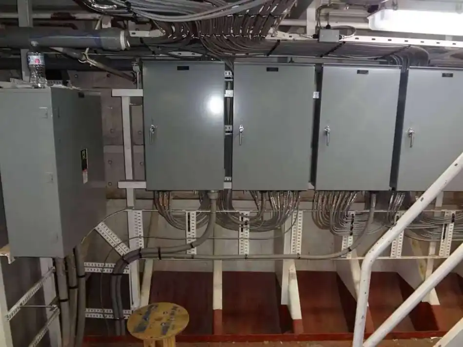 Electrical distribution boxes with cable and conduit routing