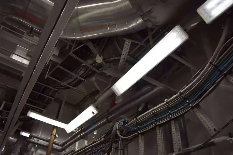 Overhead vessel cable tray and lighting installation