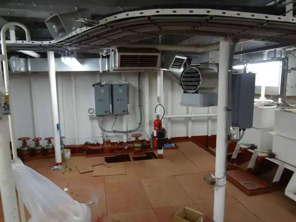 Vessel systems room with mounted controls, ducting and cable routing