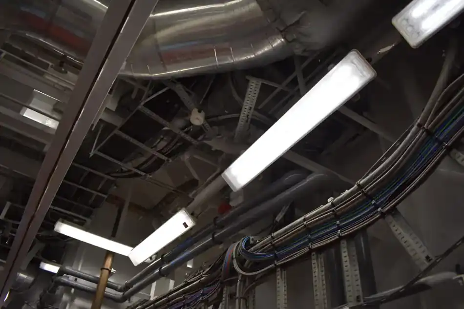 Overhead vessel electrical cable routing and lighting installation