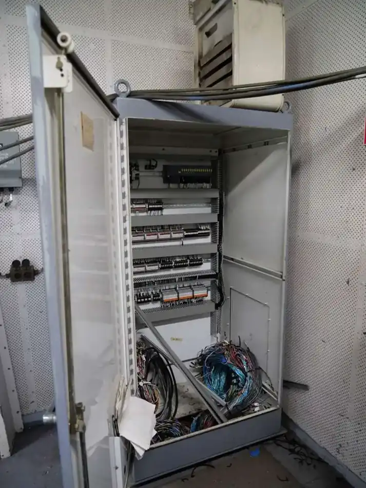 Open control cabinet with terminal blocks and field wiring